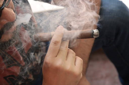 Someone smoking a cigar
